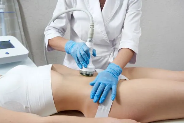 Lost the Weight but Not the Loose Skin? 2 woman having HIFU treatment on her stomach to combat loose skin Birchfield following weight loss